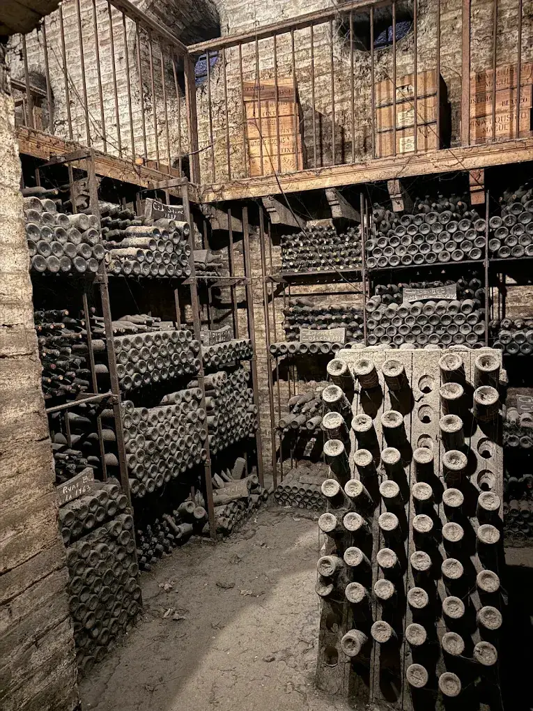 Old bottles resting in the family cellar of Cousiño Macul